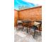 Cozy patio area with a table and chairs, perfect for enjoying outdoor relaxation at 8808 44Th Avenue W Dr, Bradenton, FL 34210