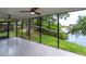 Enclosed lanai showing tile floors, screening, and waterfront views at 8808 44Th Avenue W Dr, Bradenton, FL 34210