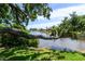 Picturesque waterfront view showcasing lush greenery and calm lake waters at 8808 44Th Avenue W Dr, Bradenton, FL 34210