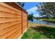 Backyard featuring a wooden fence beside a picturesque canal with lush greenery at 8808 44Th Avenue W Dr, Bradenton, FL 34210