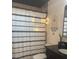 Bathroom featuring a shower with patterned curtain and dark wood vanity with black counter and a plant at 10827 Village Green Ave, Seminole, FL 33772