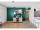 Open-concept living space with tile floors and a view to the kitchen and bar seating at 10827 Village Green Ave, Seminole, FL 33772