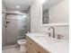 Updated bathroom with a tiled shower and a stylish vanity at 111 Whispering Sands Cir # V38, Sarasota, FL 34242