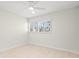 Bright bedroom featuring shutters and neutral tones at 111 Whispering Sands Cir # V38, Sarasota, FL 34242