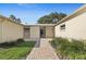 Inviting home entrance featuring a brick walkway and lush landscaping at 111 Whispering Sands Cir # V38, Sarasota, FL 34242