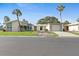 Charming single-story home with attached garage and well-maintained lawn at 111 Whispering Sands Cir # V38, Sarasota, FL 34242