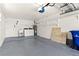Clean garage with laundry area, utility sink, and ample storage shelves at 111 Whispering Sands Cir # V38, Sarasota, FL 34242