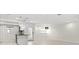 Bright living room featuring tiled floors, recessed lights, kitchen, and front door at 111 Whispering Sands Cir # V38, Sarasota, FL 34242