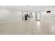 Bright and open living room featuring tile floors and an eat-in kitchen area at 111 Whispering Sands Cir # V38, Sarasota, FL 34242