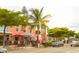 This vibrant Siesta Key Village has multiple shops, outdoor dining, and a lively atmosphere in a tropical setting at 111 Whispering Sands Cir # V38, Sarasota, FL 34242