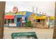 This storefront in Siesta Key Village boasts colorful shops like Lobster Pot and Mini Donuts for a vibrant shopping experience at 111 Whispering Sands Cir # V38, Sarasota, FL 34242