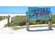The Siesta Beach sign welcomes visitors to one of the top-rated beaches in the U.S at 111 Whispering Sands Cir # V38, Sarasota, FL 34242