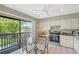Cozy eat in kitchen dining room with view to a balcony at 1159 Lake House Cir # C120, Sarasota, FL 34242