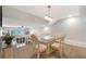 Elevated dining room with unique table and seating for four at 1159 Lake House Cir # C120, Sarasota, FL 34242