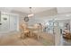 Cozy lofted dining room with seating for four and neutral carpet at 1159 Lake House Cir # C120, Sarasota, FL 34242
