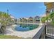 Waterfront condo with lake views and well-maintained landscaping on a sunny day at 1159 Lake House Cir # C120, Sarasota, FL 34242