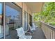 Comfortable condo patio with seating and views of lush tropical landscaping at 1159 Lake House Cir # C120, Sarasota, FL 34242