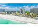 Beautiful aerial view of beachfront condos with a pristine white sand beach and clear turquoise water at 1212 Benjamin Franklin Dr # 909, Sarasota, FL 34236
