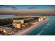 Expansive coastal condos on pristine beach, turquoise waters, showcasing luxury and scenic views at 1212 Benjamin Franklin Dr # 909, Sarasota, FL 34236
