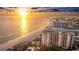Beautiful beachfront condo building with picturesque views of the Gulf, beach access, and coastal cityscape at 1212 Benjamin Franklin Dr # 909, Sarasota, FL 34236
