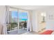 Relax on the balcony offering serene ocean views and access to the bedroom and ensuite bathroom at 1212 Benjamin Franklin Dr # 909, Sarasota, FL 34236