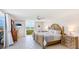 Inviting bedroom with balcony access, water views, and coastal-themed decor, creating a relaxing retreat at 1212 Benjamin Franklin Dr # 909, Sarasota, FL 34236
