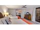 Bright bedroom with two beds, a view of the sunset, and access to a balcony at 1212 Benjamin Franklin Dr # 909, Sarasota, FL 34236