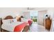 Bedroom with two beds and an expansive view of the bay at 1212 Benjamin Franklin Dr # 909, Sarasota, FL 34236