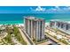 Beautiful view of building, showcasing beach access and a coastal vibe at 1212 Benjamin Franklin Dr # 909, Sarasota, FL 34236