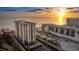 Luxury condos featuring a stunning beachfront location with expansive views of the ocean at sunset at 1212 Benjamin Franklin Dr # 909, Sarasota, FL 34236