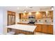 Contemporary kitchen boasts stainless appliances, ample counter space, and custom cabinetry at 1212 Benjamin Franklin Dr # 909, Sarasota, FL 34236