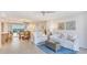 Spacious living area seamlessly connects to the dining area and showcases breathtaking water views from the balcony at 1212 Benjamin Franklin Dr # 909, Sarasota, FL 34236