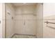 Tiled shower with glass door and built-in shelves at 1212 Benjamin Franklin Dr # 909, Sarasota, FL 34236