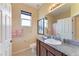Bathroom with granite countertop, framed mirror, framed print, and a neutral color scheme at 12815 24Th Street E Cir, Parrish, FL 34219