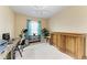 Bright bedroom with a ceiling fan, ample space, and a functional layout, perfect for a home office at 12815 24Th Street E Cir, Parrish, FL 34219