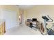 Bedroom with a work area including desk and chair, complemented by a spacious closet at 12815 24Th Street E Cir, Parrish, FL 34219
