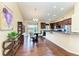Eat-in kitchen featuring stainless appliances, dark wood cabinets, granite counters and lots of natural light at 12815 24Th Street E Cir, Parrish, FL 34219