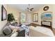 Bright living room featuring a ceiling fan, neutral walls, hardwood floors and comfortable seating at 12815 24Th Street E Cir, Parrish, FL 34219