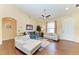 Bright living room featuring hardwood floors, vaulted ceilings, and modern furniture for a cozy ambiance at 12815 24Th Street E Cir, Parrish, FL 34219