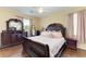 The main bedroom includes hardwood floors and natural light at 12815 24Th Street E Cir, Parrish, FL 34219
