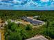 Overhead shot highlighting modern homes, showcasing their sleek designs and spacious layouts surrounded by lush greenery at 1375 Norwalk Ter, Port Charlotte, FL 33953