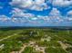 Beautiful aerial view of a home surrounded by lush greenery, highlighted with a red outline for emphasis at 1375 Norwalk Ter, Port Charlotte, FL 33953