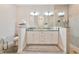 Bathroom featuring a double vanity with stone countertops and a walk-in shower at 1375 Norwalk Ter, Port Charlotte, FL 33953