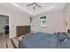 Comfortable bedroom featuring a queen bed, dresser, and ample natural light from the large windows at 1375 Norwalk Ter, Port Charlotte, FL 33953