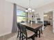 Eat in kitchen features a large window with views of the private lot at 1375 Norwalk Ter, Port Charlotte, FL 33953