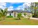 Attractive single-Gathering home with a well-kept lawn, two-car garage, and inviting curb appeal, ideal for families at 1375 Norwalk Ter, Port Charlotte, FL 33953