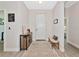 Inviting foyer with a decorative rug, bench, and console table at 1375 Norwalk Ter, Port Charlotte, FL 33953