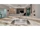 Open concept kitchen with a large sink and granite counters overlooks the modern living area at 1375 Norwalk Ter, Port Charlotte, FL 33953