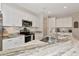 Modern kitchen features white cabinets, granite countertops, and stainless steel appliances at 1375 Norwalk Ter, Port Charlotte, FL 33953