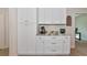 Kitchen with elegant white cabinetry, granite counters, and stainless steel appliances, offers space for home essentials at 1375 Norwalk Ter, Port Charlotte, FL 33953